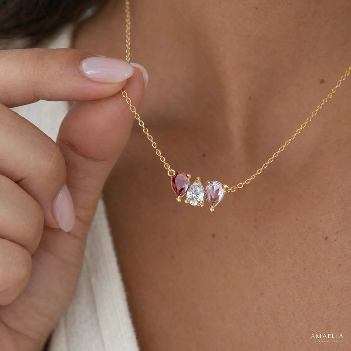 Close-up of the ROSALIE necklace with three birthstones at the neckline