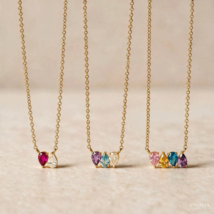 Three ROSALIE necklaces in gold, with one, three and four birthstones